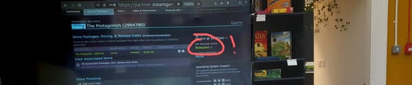 Steam page on a projector in a cafe with 'Released' highlighted